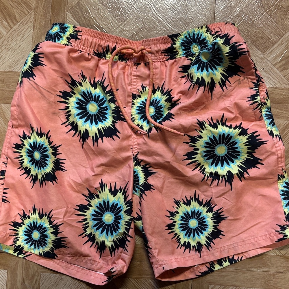 No Boundaries Coral Swim Trunks with Yellow, Black & Turquoise Sunburst Print